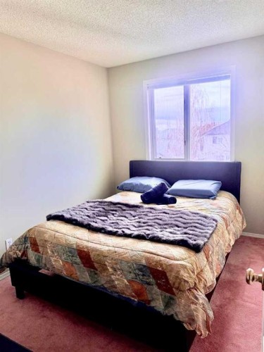 7212 Sierra Morena Boulevard Sw, Calgary, AB - Indoor Photo Showing Bedroom