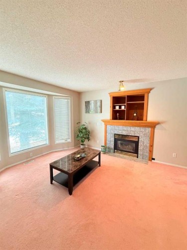 7212 Sierra Morena Boulevard Sw, Calgary, AB - Indoor Photo Showing Living Room With Fireplace