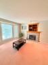 7212 Sierra Morena Boulevard Sw, Calgary, AB  - Indoor Photo Showing Living Room With Fireplace 