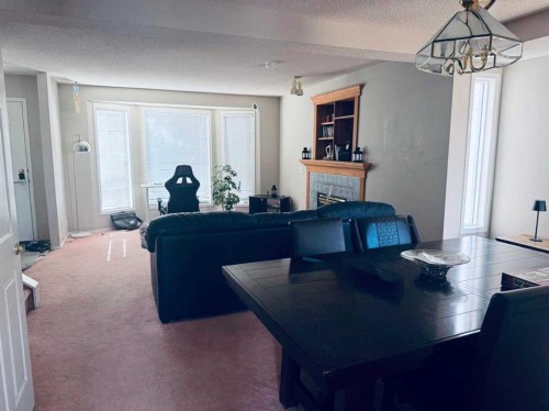 7212 Sierra Morena Boulevard Sw, Calgary, AB - Indoor With Fireplace
