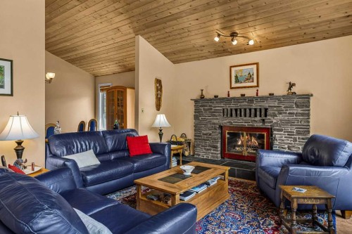 1054 Evergreen Circle, Canmore, AB - Indoor Photo Showing Living Room With Fireplace