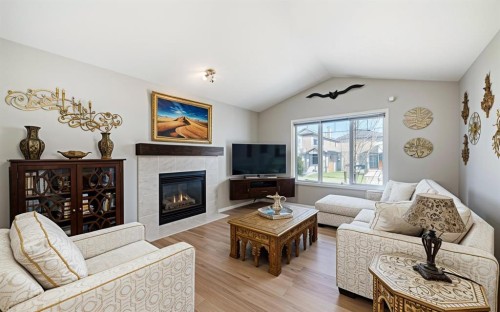 231 Saddlebrook Way Ne, Calgary, AB - Indoor Photo Showing Living Room With Fireplace
