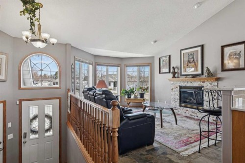 28 Westpoint Drive, Didsbury, AB - Indoor Photo Showing Living Room With Fireplace