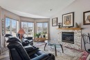28 Westpoint Drive, Didsbury, AB  - Indoor Photo Showing Living Room With Fireplace 