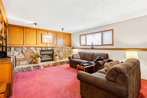 149 Edgehill Drive Nw, Calgary, AB - Indoor Photo Showing Living Room With Fireplace