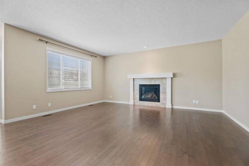 30 Redstone Parade Ne, Calgary, AB - Indoor Photo Showing Living Room With Fireplace