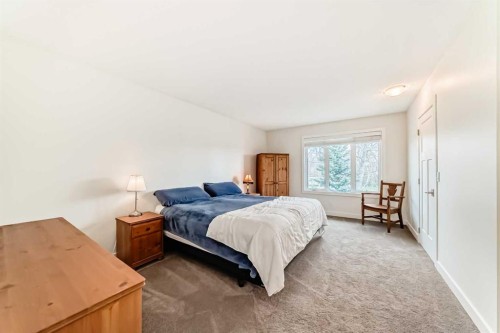 609 Downey Place, Okotoks, AB - Indoor Photo Showing Bedroom