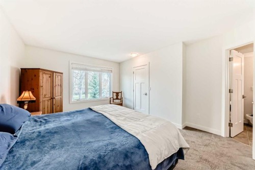 609 Downey Place, Okotoks, AB - Indoor Photo Showing Bedroom