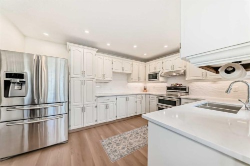 609 Downey Place, Okotoks, AB - Indoor Photo Showing Kitchen With Double Sink