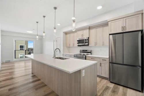 3403-33 Carringham Gate Nw, Calgary, AB - Indoor Photo Showing Kitchen With Stainless Steel Kitchen With Double Sink With Upgraded Kitchen
