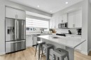 125 Emberside Hollow, Cochrane, AB  - Indoor Photo Showing Kitchen With Stainless Steel Kitchen With Upgraded Kitchen 