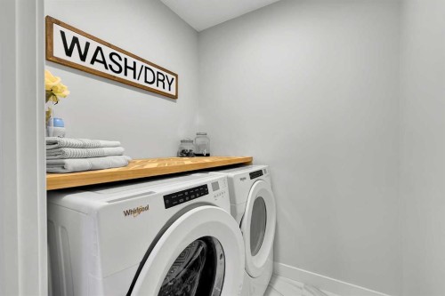 125 Emberside Hollow, Cochrane, AB - Indoor Photo Showing Laundry Room