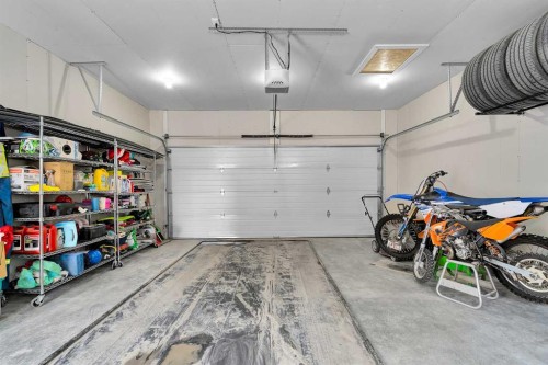 125 Emberside Hollow, Cochrane, AB - Indoor Photo Showing Garage