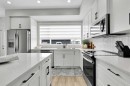 125 Emberside Hollow, Cochrane, AB  - Indoor Photo Showing Kitchen With Stainless Steel Kitchen With Upgraded Kitchen 