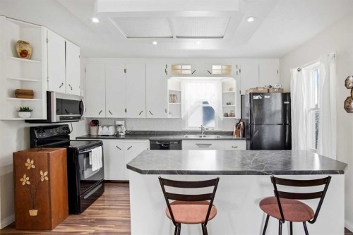4306 55 Avenue, Olds, AB - Indoor Photo Showing Kitchen With Double Sink