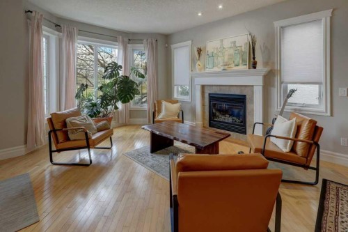 104-449 20 Avenue Ne, Calgary, AB - Indoor Photo Showing Living Room With Fireplace