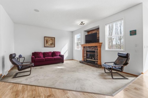 36 Wentworth Close Sw, Calgary, AB - Indoor Photo Showing Living Room With Fireplace
