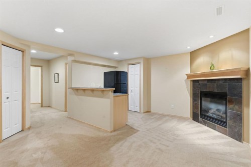 36 Wentworth Close Sw, Calgary, AB - Indoor Photo Showing Living Room With Fireplace