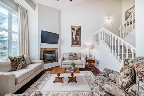 305 Sandringham Road Nw, Calgary, AB - Indoor Photo Showing Living Room With Fireplace