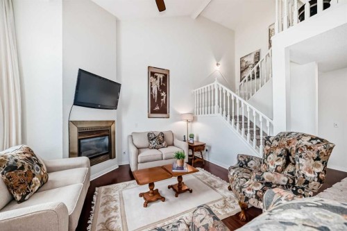 305 Sandringham Road Nw, Calgary, AB - Indoor Photo Showing Living Room With Fireplace