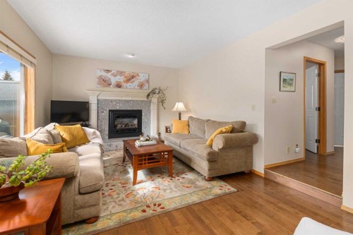 27 Hawkstone Close Nw, Calgary, AB - Indoor Photo Showing Living Room With Fireplace