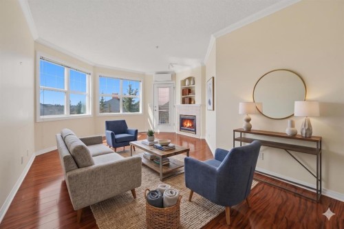 311-78 Prestwick Gardens Se, Calgary, AB - Indoor Photo Showing Living Room With Fireplace