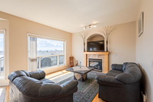 37 Royal Birch Close Nw, Calgary, AB - Indoor Photo Showing Living Room With Fireplace