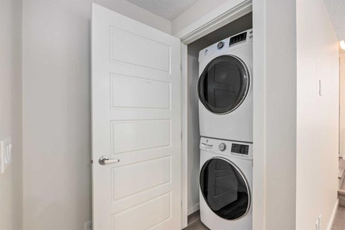 305 Cranbrook Square Se, Calgary, AB - Indoor Photo Showing Laundry Room