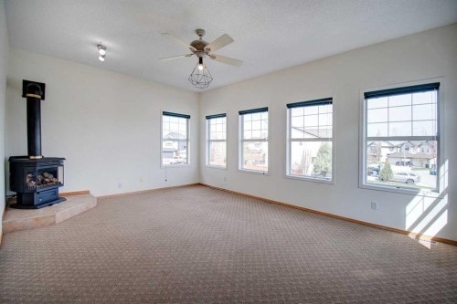 96 Cranfield Park Se, Calgary, AB - Indoor Photo Showing Other Room With Fireplace