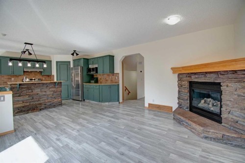 96 Cranfield Park Se, Calgary, AB - Indoor Photo Showing Living Room With Fireplace
