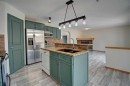 96 Cranfield Park Se, Calgary, AB  - Indoor Photo Showing Kitchen With Double Sink 