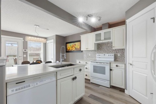 18 West Springs Gate Sw, Calgary, AB - Indoor Photo Showing Kitchen With Double Sink