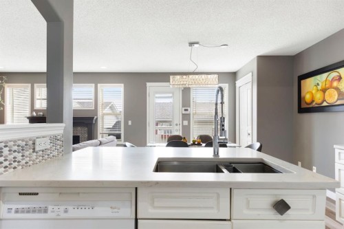 18 West Springs Gate Sw, Calgary, AB - Indoor Photo Showing Kitchen With Double Sink