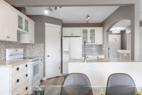 18 West Springs Gate Sw, Calgary, AB - Indoor Photo Showing Kitchen With Upgraded Kitchen