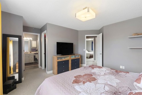 18 West Springs Gate Sw, Calgary, AB - Indoor Photo Showing Bedroom