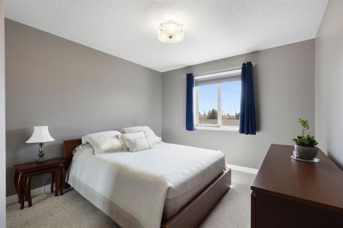 18 West Springs Gate Sw, Calgary, AB - Indoor Photo Showing Bedroom