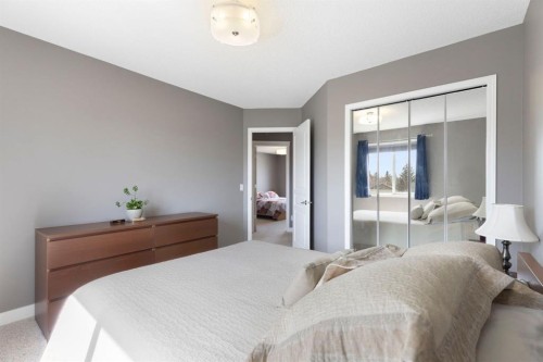 18 West Springs Gate Sw, Calgary, AB - Indoor Photo Showing Bedroom