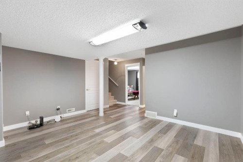 18 West Springs Gate Sw, Calgary, AB - Indoor Photo Showing Other Room