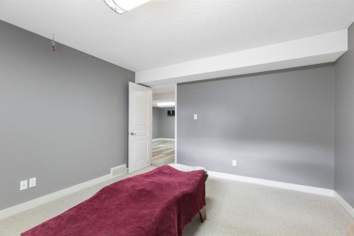 18 West Springs Gate Sw, Calgary, AB - Indoor Photo Showing Bedroom