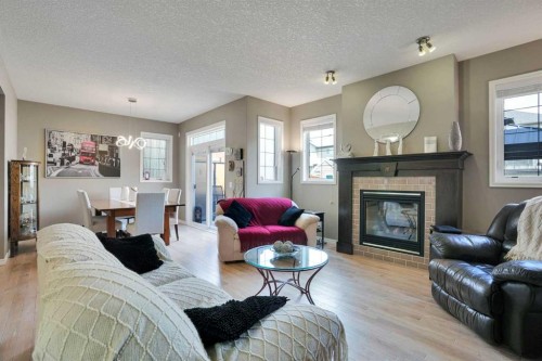 109 Cranleigh Place Se, Calgary, AB - Indoor Photo Showing Living Room With Fireplace