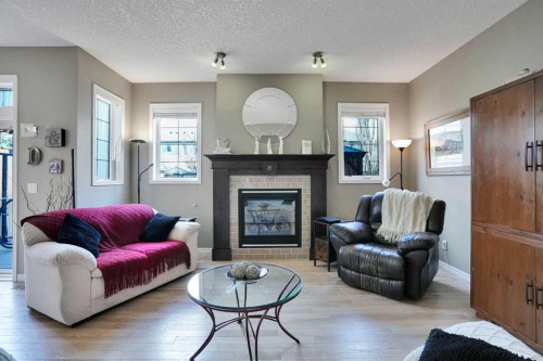 109 Cranleigh Place Se, Calgary, AB - Indoor Photo Showing Living Room With Fireplace