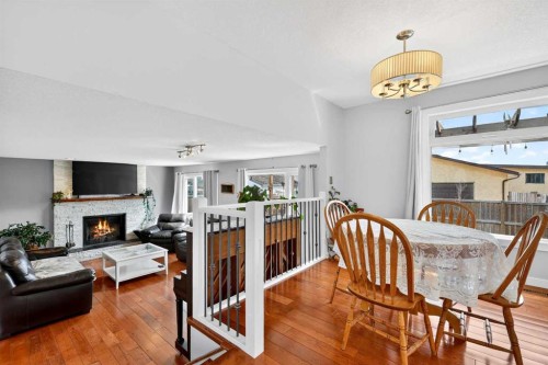 117 Bonitz Court, Carseland, AB - Indoor Photo Showing Dining Room With Fireplace