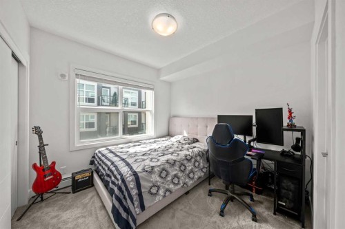 305-19661 40 Street Se, Calgary, AB - Indoor Photo Showing Bedroom