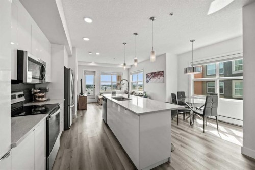 305-19661 40 Street Se, Calgary, AB - Indoor Photo Showing Kitchen With Stainless Steel Kitchen With Upgraded Kitchen