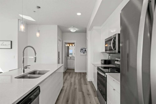 305-19661 40 Street Se, Calgary, AB - Indoor Photo Showing Kitchen With Stainless Steel Kitchen With Double Sink With Upgraded Kitchen
