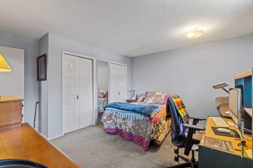 7 Canna Bay Sw, Calgary, AB - Indoor Photo Showing Bedroom