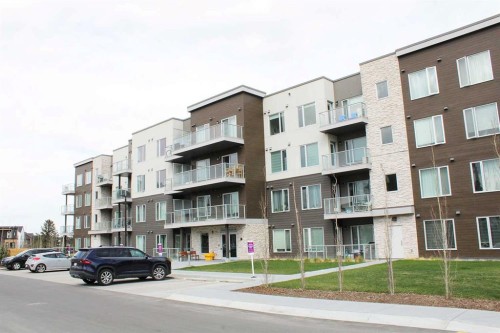 205-700 Shawnee Square Sw, Calgary, AB - Outdoor With Balcony With Facade