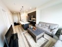 205-700 Shawnee Square Sw, Calgary, AB  - Indoor Photo Showing Living Room 