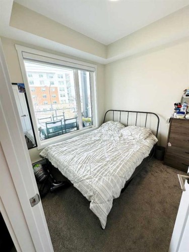 205-700 Shawnee Square Sw, Calgary, AB - Indoor Photo Showing Bedroom