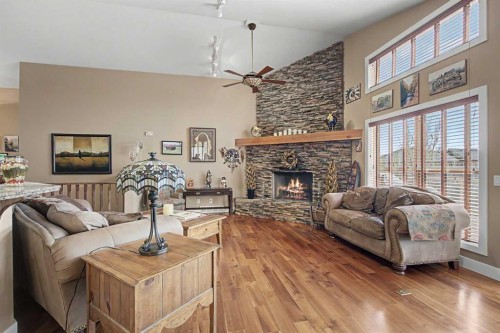 183 Discovery Ridge Way Sw, Calgary, AB - Indoor Photo Showing Living Room With Fireplace